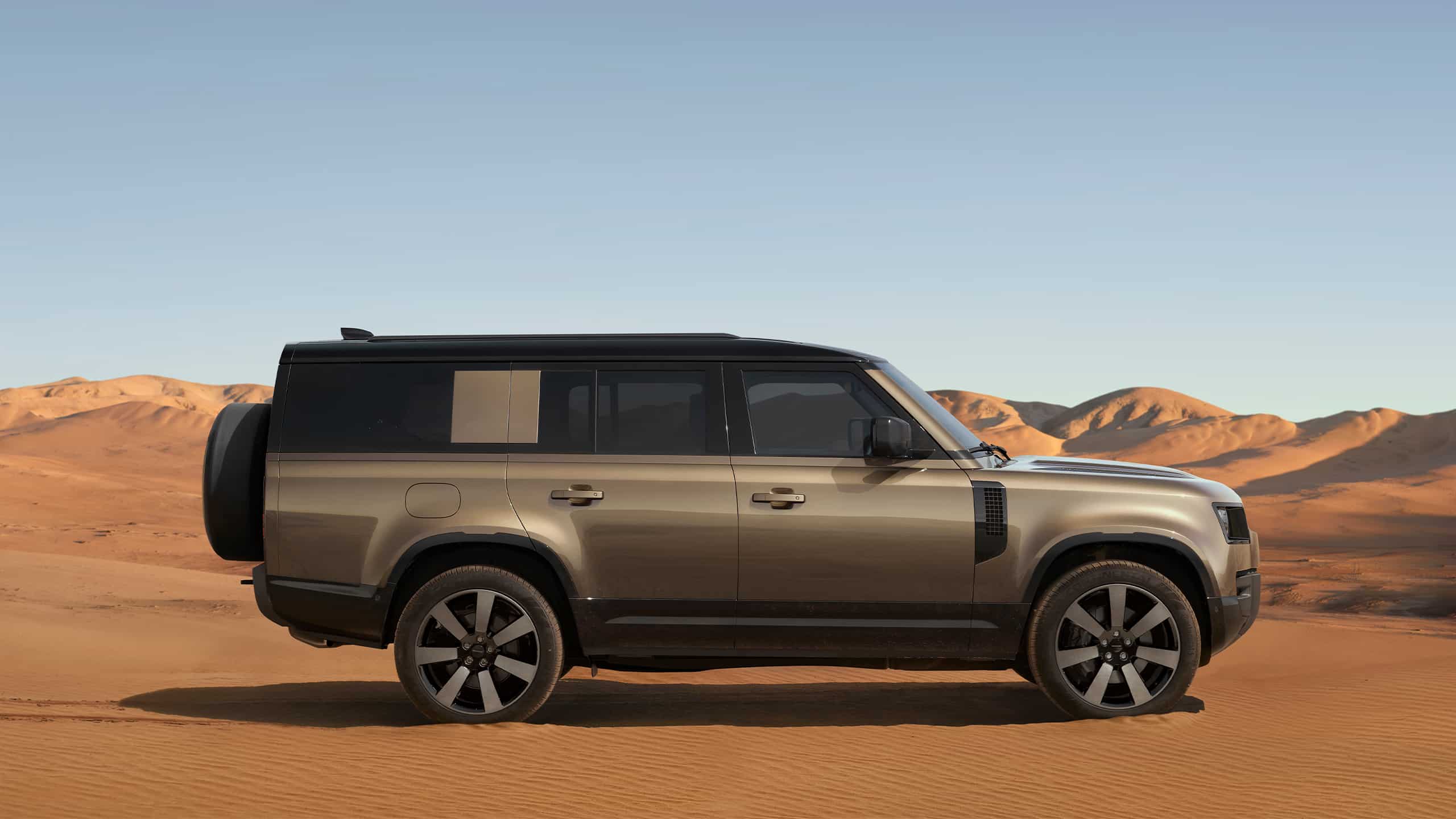 Defender driving in the desert